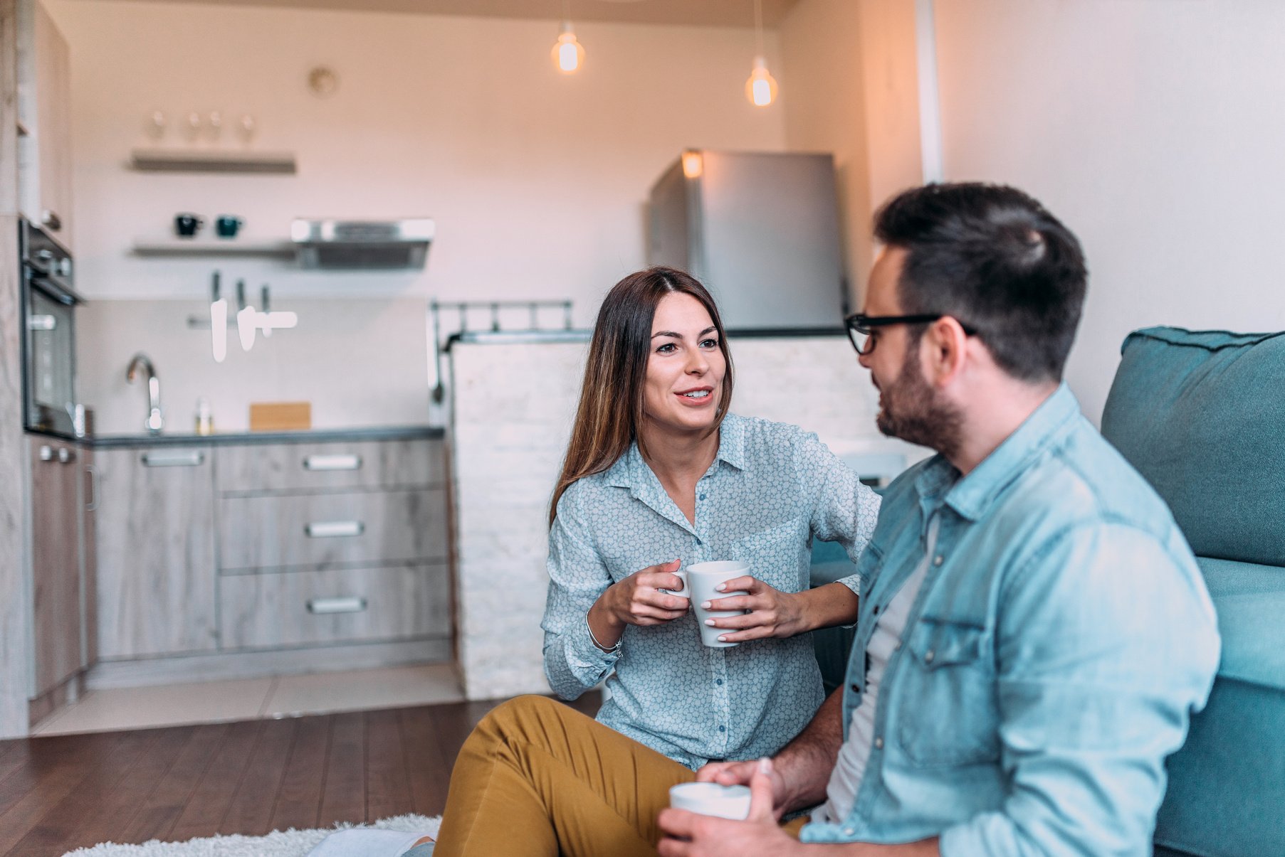 Cute couple talking indoors.